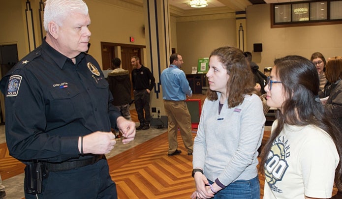 Chief Loftus speaking with students